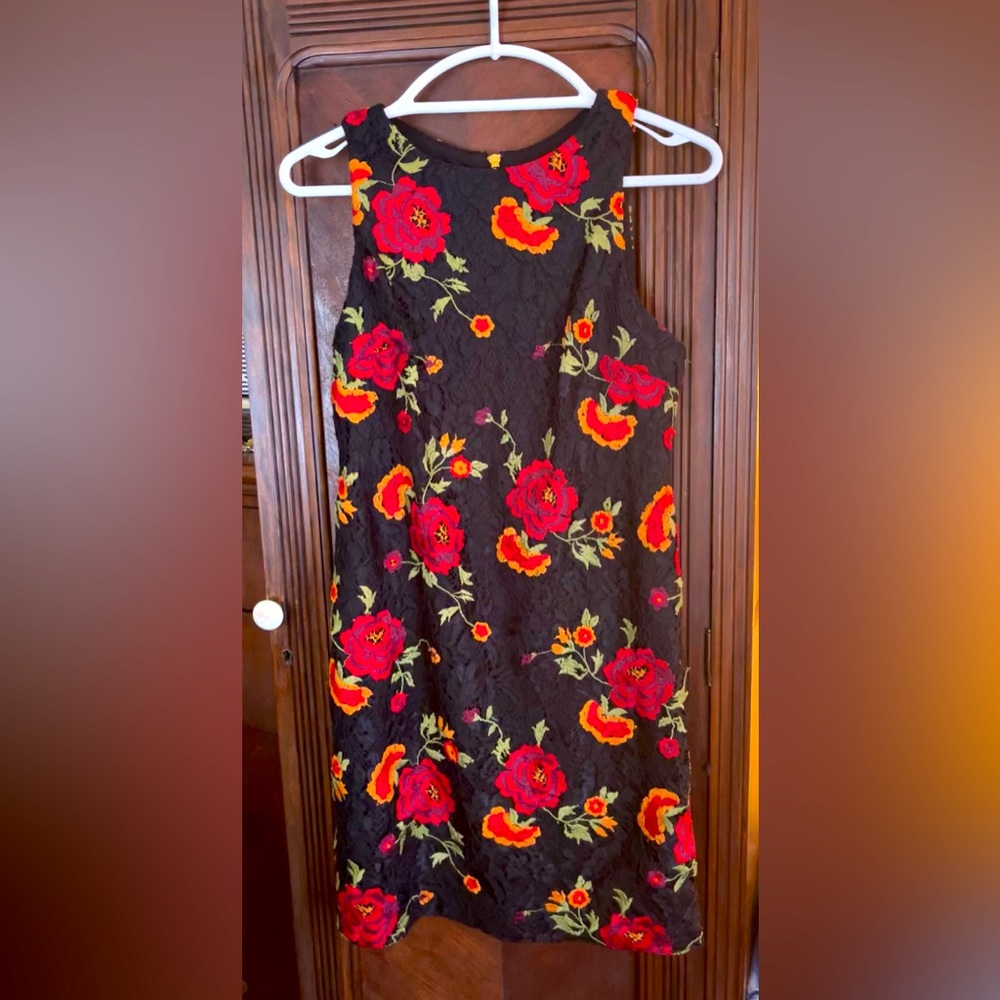 Ladies knee to above knee black lace with beautiful red and orange flowers.